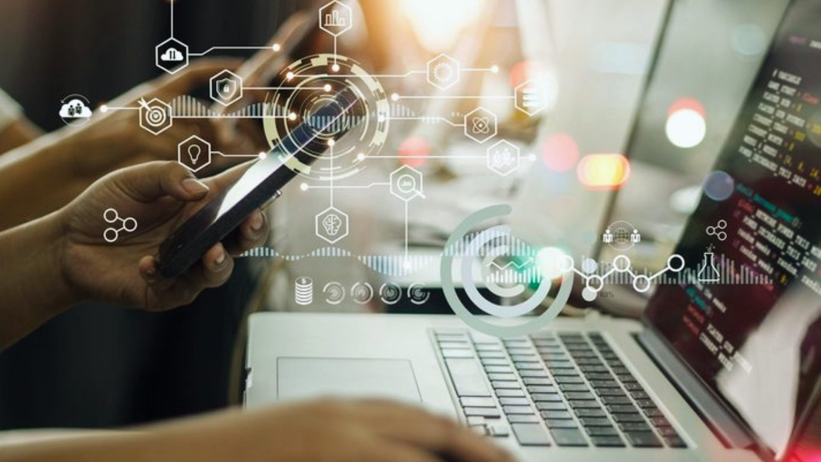 A person working on a laptop, engaging with a digital interface on the screen.