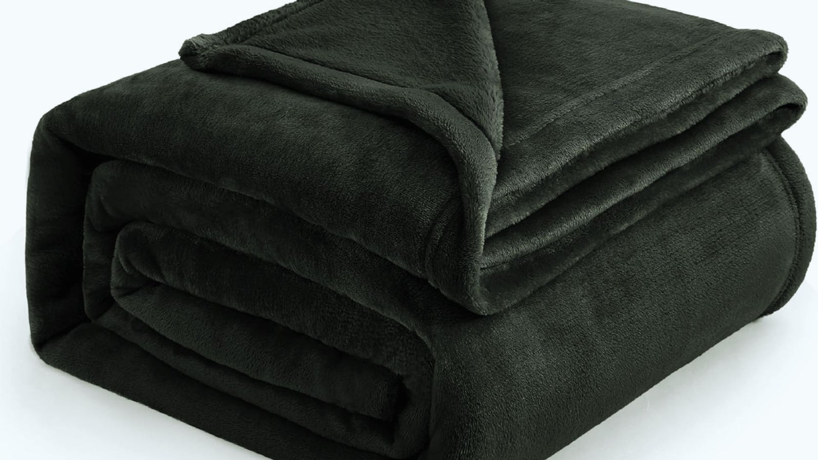 A neatly folded black blanket displayed on a flat surface.
