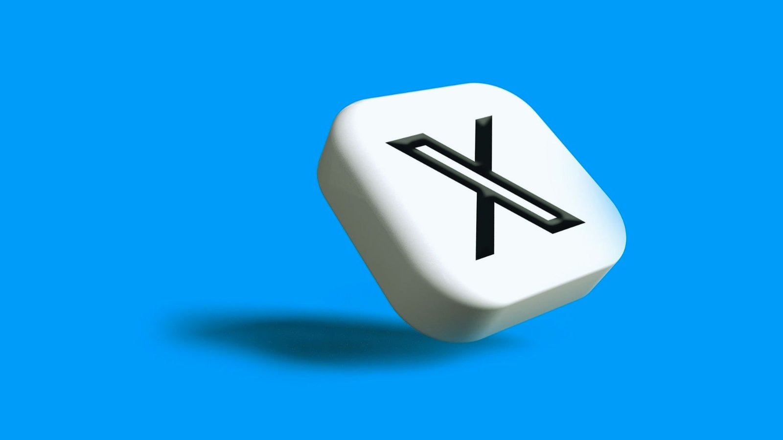  A white die displaying the letter 'X' prominently on one of its faces.