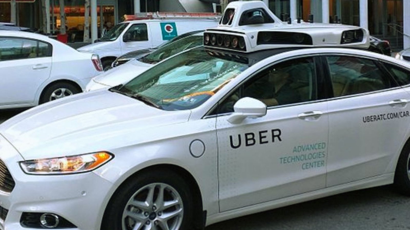  A file photo of Uber's self-driving cars parked together, showcasing their sleek design and advanced technology.