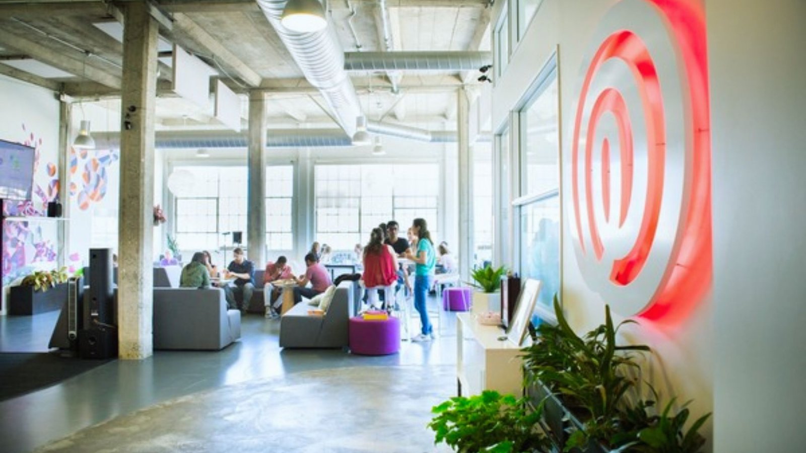 A large red Target logo displayed prominently on the wall of a building.