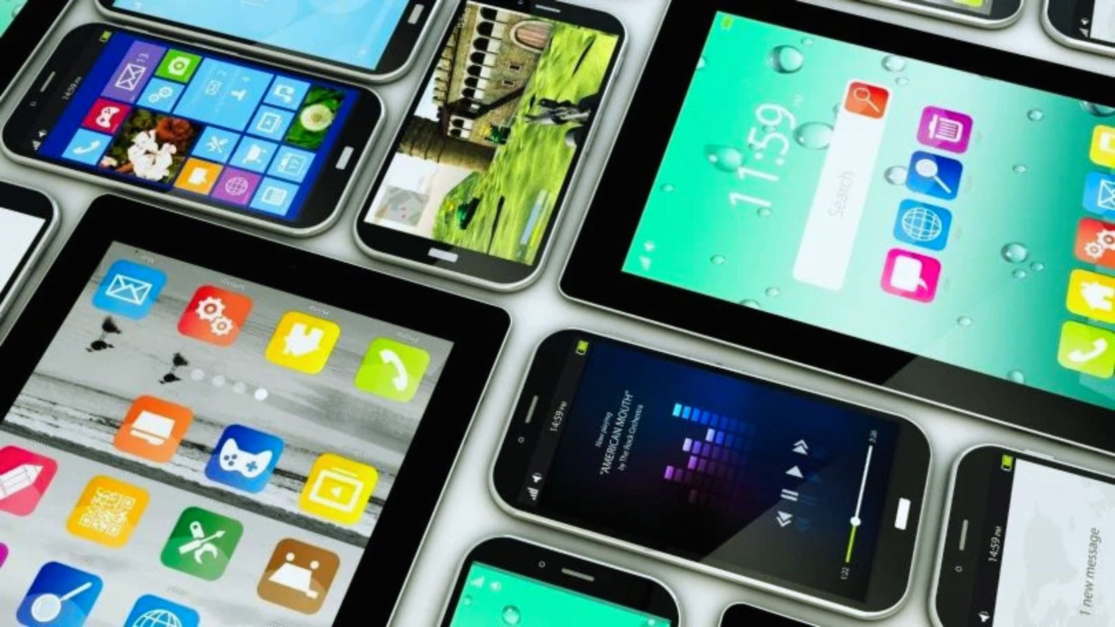 . A collection of various mobile devices, including smartphones, tablets, and smartwatches, displayed together on a surface.