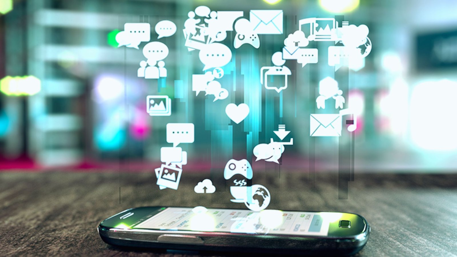 Mobile phone displaying various social media icons on its screen, showcasing connectivity and digital interaction.