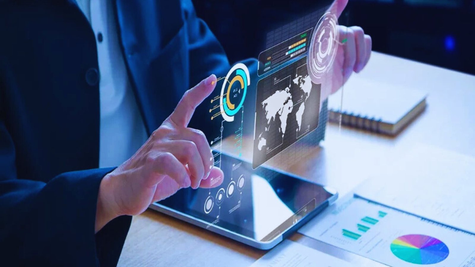 A person in a suit examines a tablet displaying a graph, indicating data analysis or business performance.