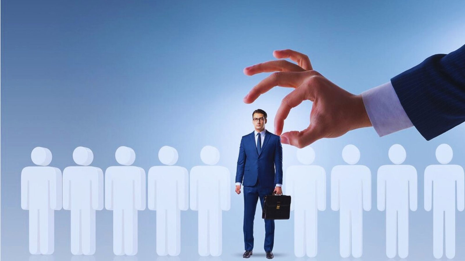 . A man in a suit stands confidently before a group of attentive people, engaging them with his presentation.