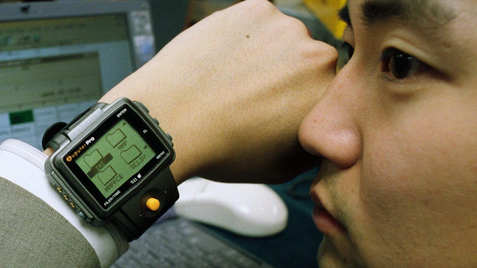  A man wearing a stylish watch on his wrist, looking confidently at the camera.