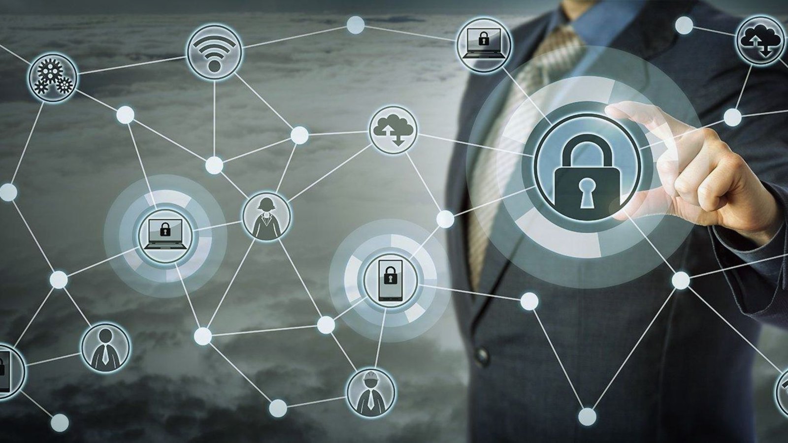Businessman in a suit holds a padlock surrounded by digital security icons, symbolizing data protection and cybersecurity.