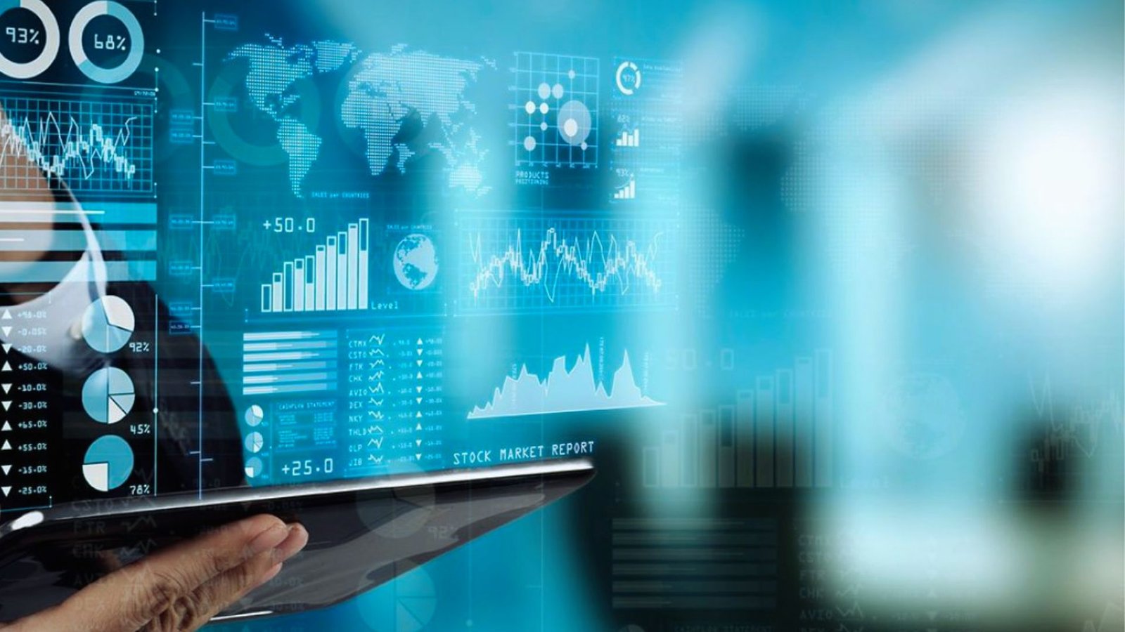 Businessman analyzing business graphs on a tablet, focused on data trends and insights for decision-making.