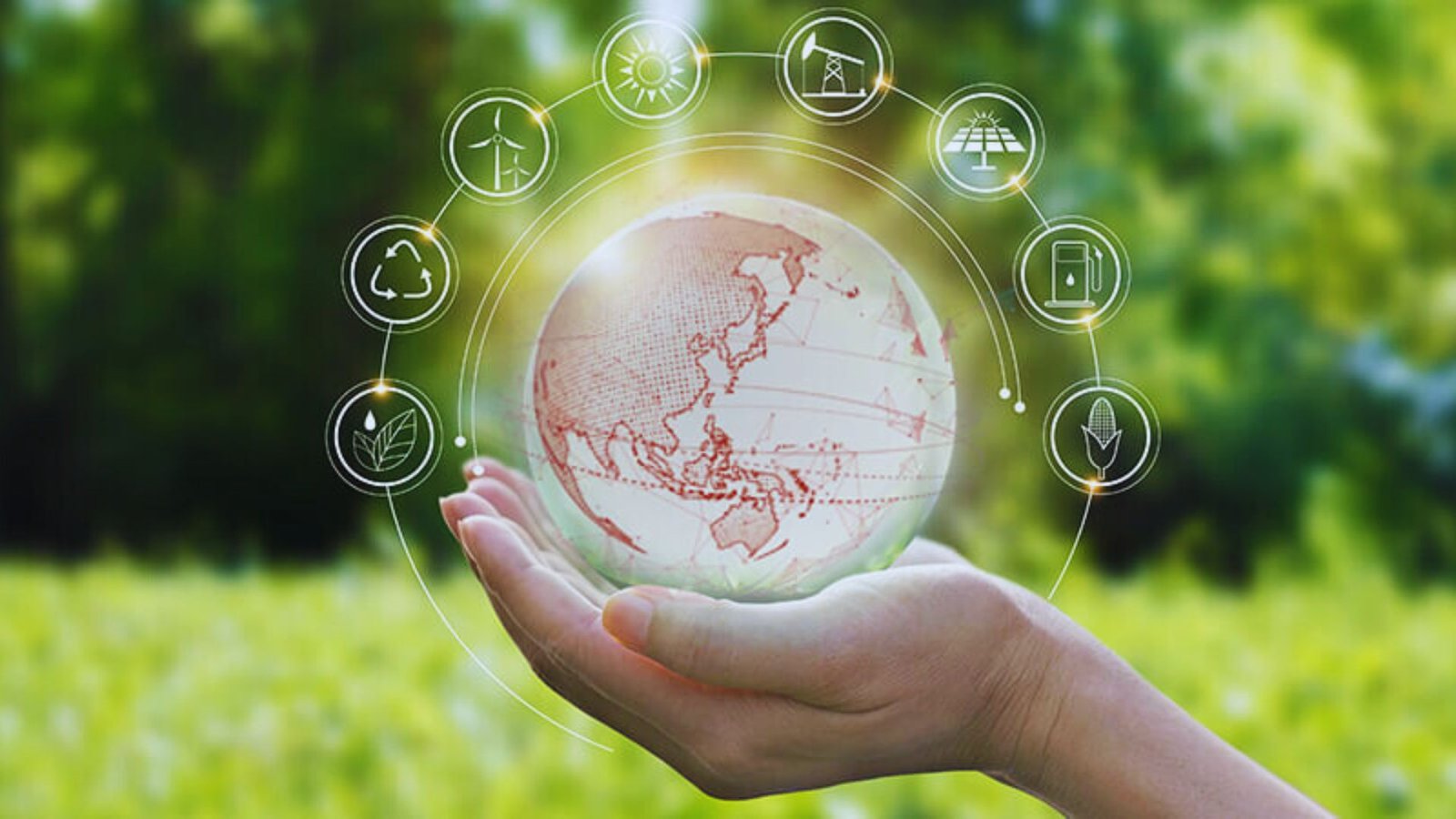 A hand holds a globe adorned with various icons, symbolizing global connectivity and diverse themes.