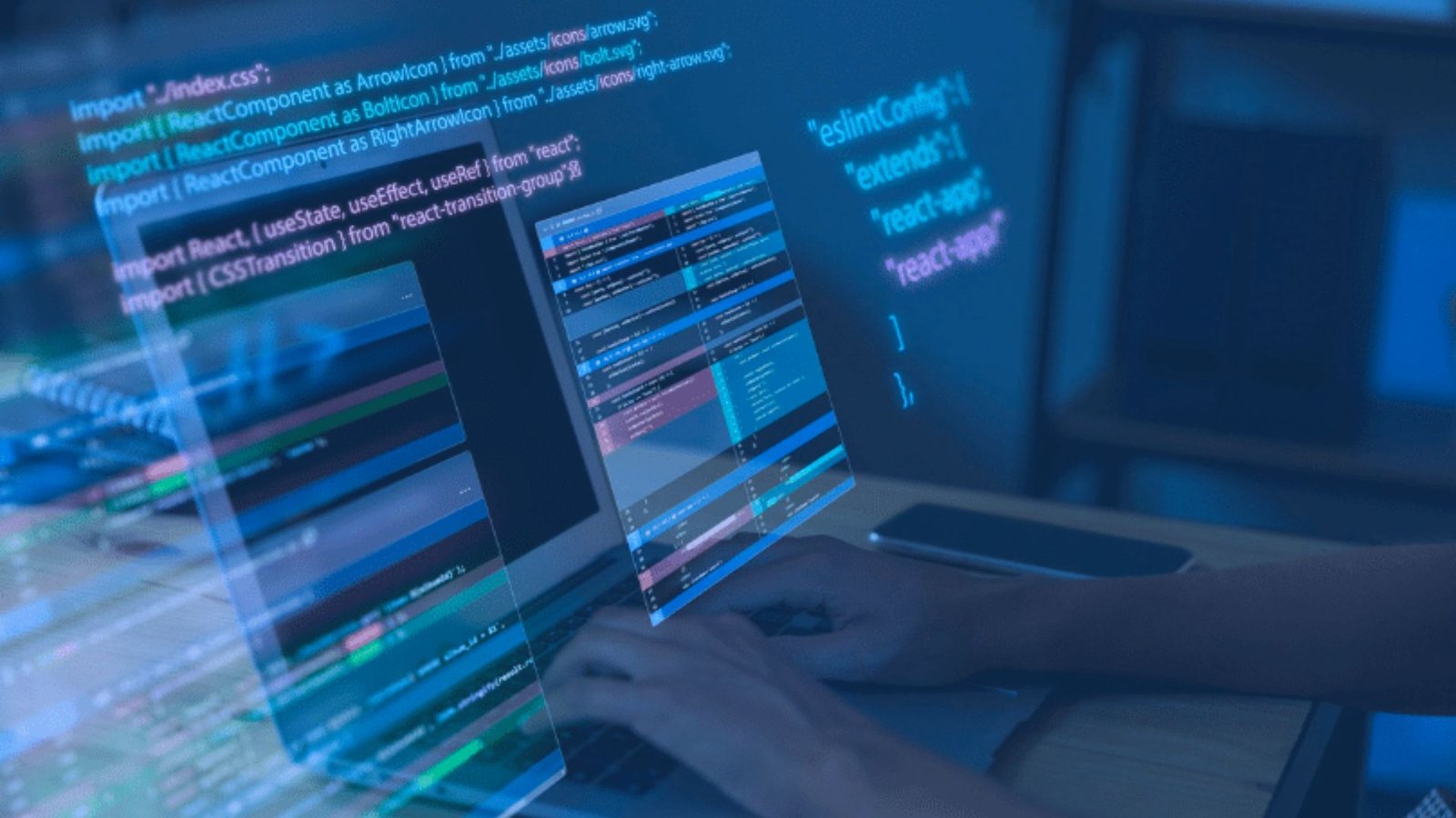 A person typing on a laptop, focused on the screen, with hands positioned over the keyboard.