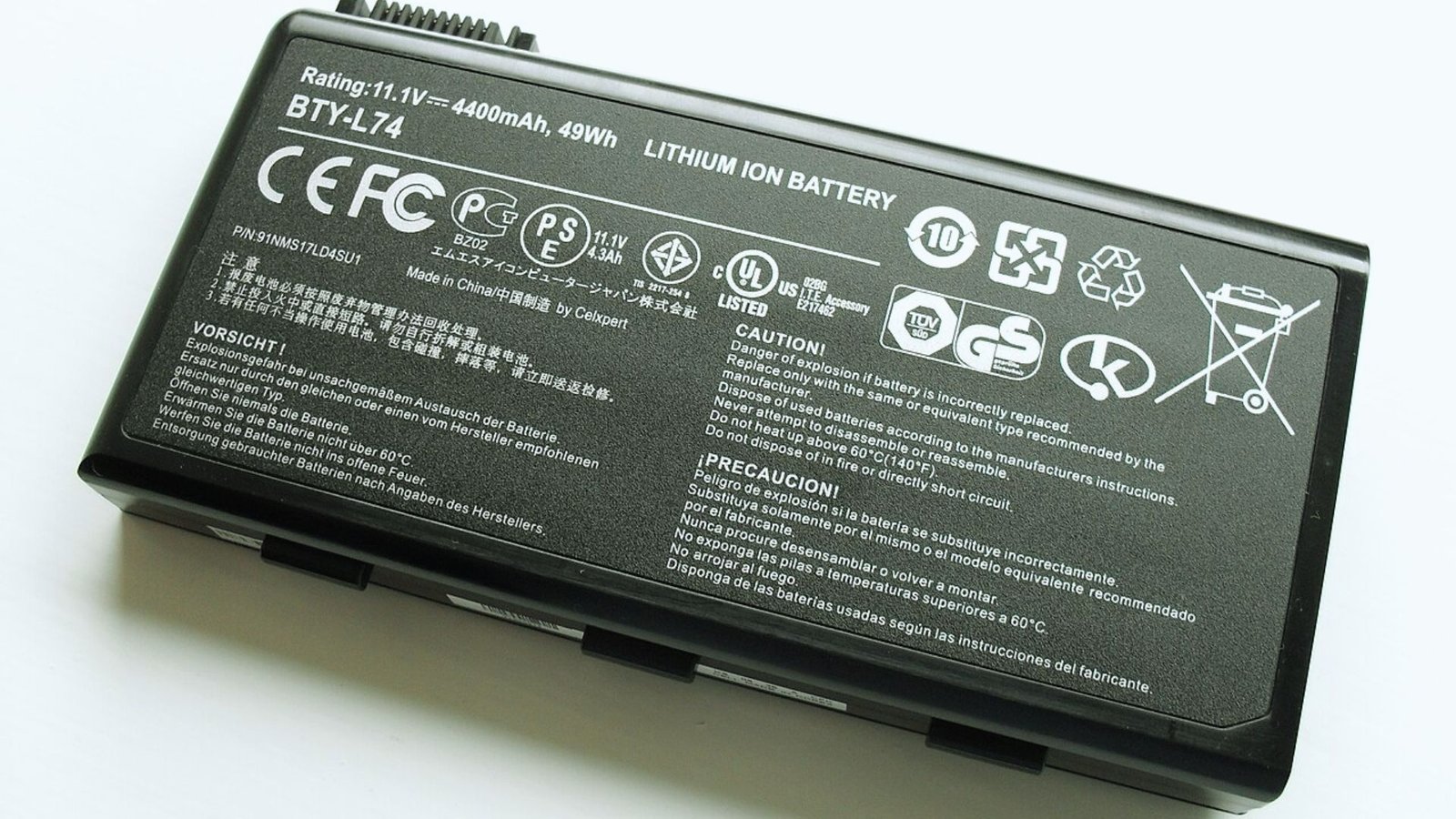 Black laptop battery labeled with the words "battery" on its surface, emphasizing its function and purpose.
