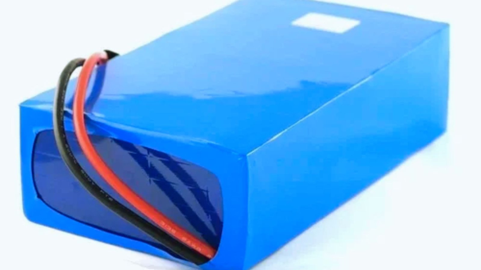  A blue battery pack with wires and a red cord, positioned on a neutral background.
