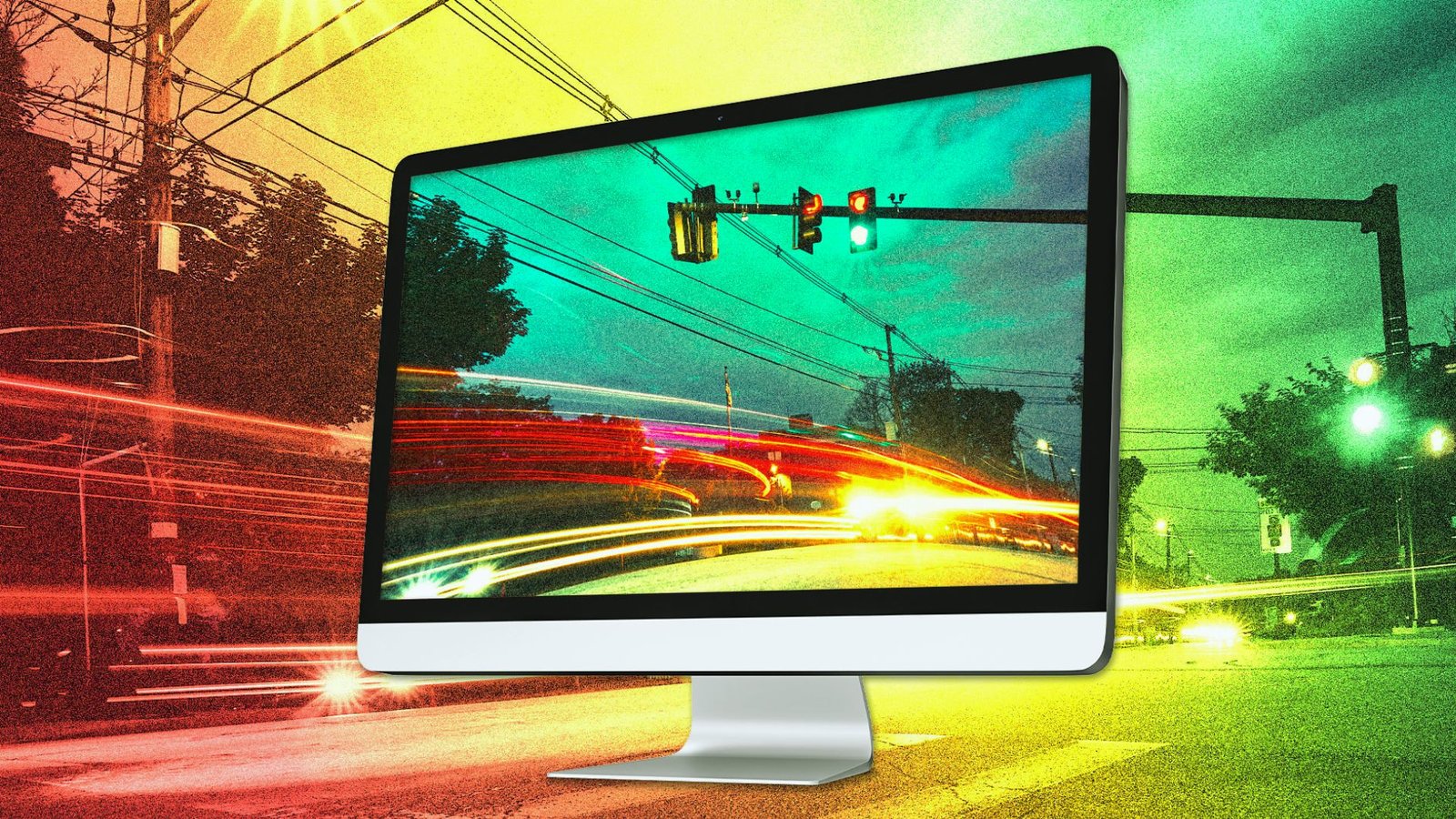 A computer monitor with a traffic light visible in the background, highlighting urban technology and traffic management.