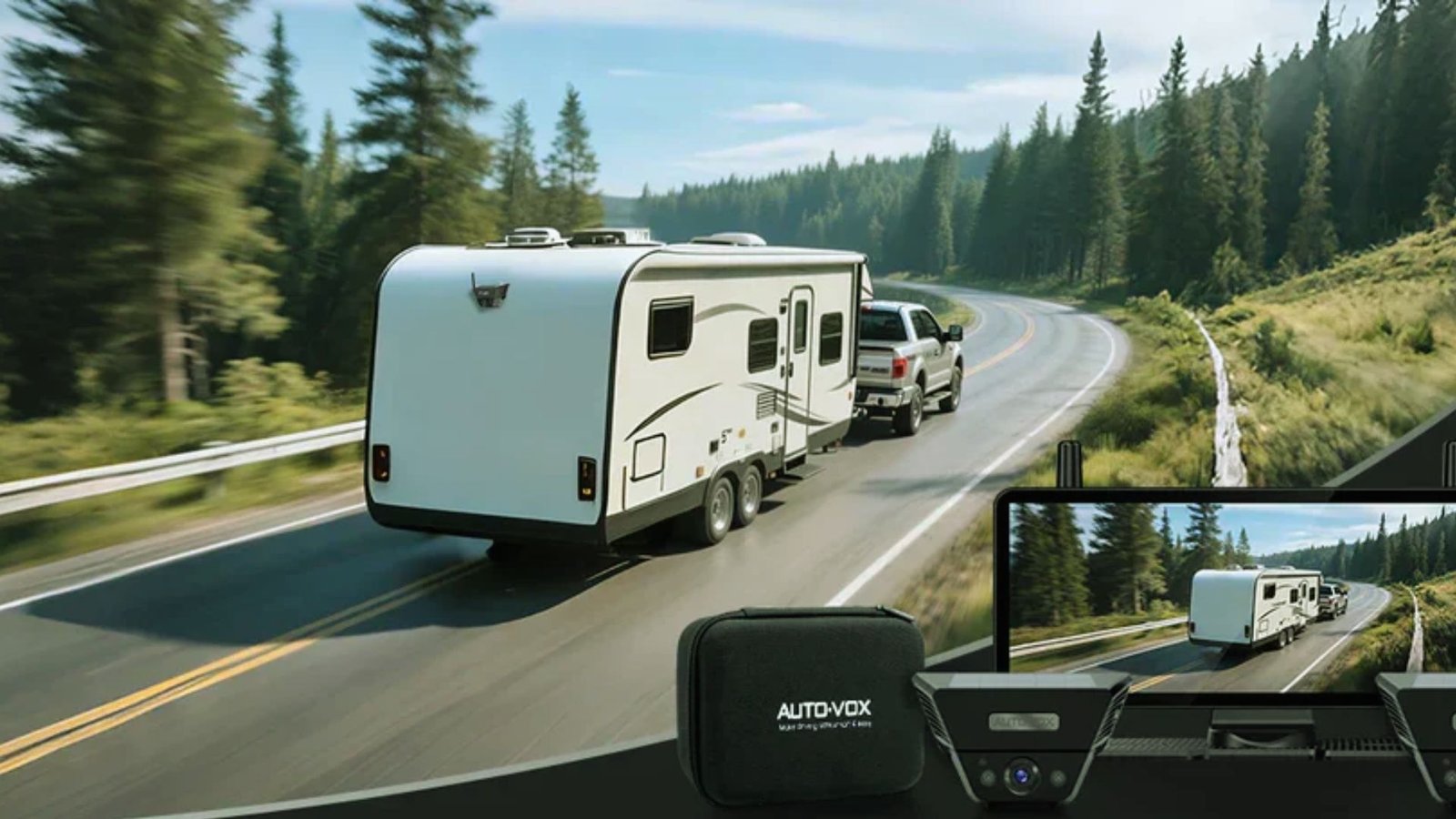 A white RV is being towed by a vehicle on a scenic, winding road lined with lush green pine trees. Inset shows a camera view of the same scene.